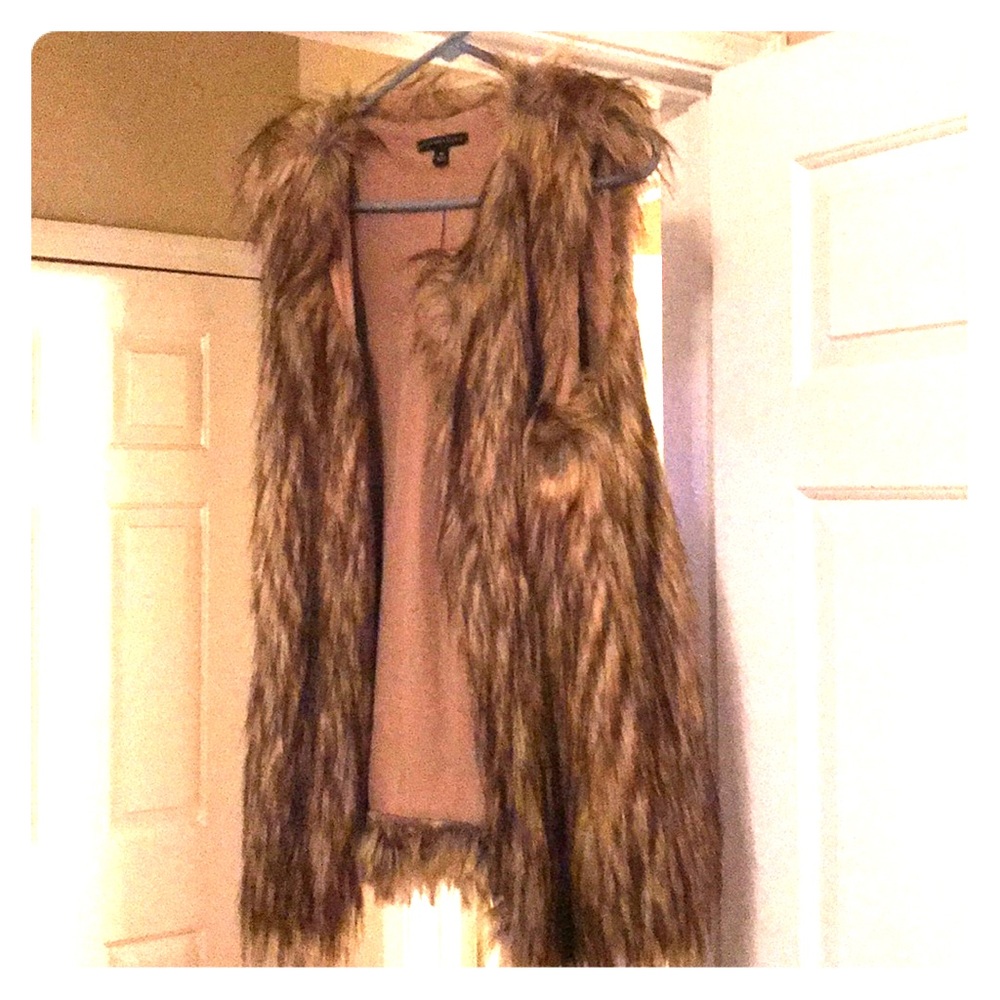 Good and black fur vest